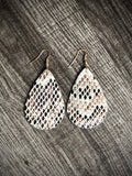 Snake skin earrings in white