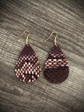 Snake skin earrings in brown